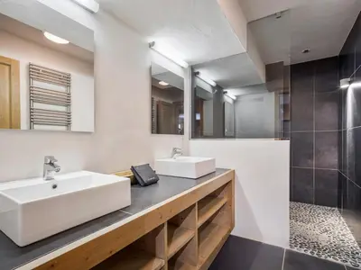 a bathroom with a sink and a mirror at Chalet de Luxe: 13 pers, Jacuzzi, Animaux Admis - FR-1-663-60 in Saint-Gervais-les-Bains