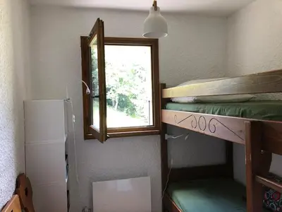 a room with a bunk bed and a window at Full nature, 4 people, Saint-Gervais, Chamonix in Saint-Gervais-les-Bains