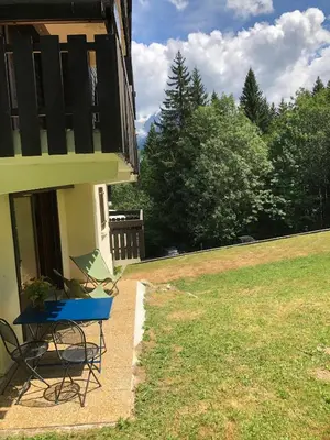 a table and chairs sitting outside of a house at Full nature, 4 people, Saint-Gervais, Chamonix in Saint-Gervais-les-Bains