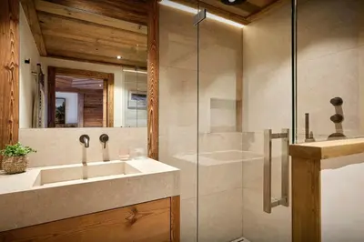 a bathroom with a sink and a shower at Chalet Lauda - OVO Network in Saint-Nicolas-de-Véroce
