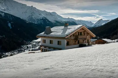 a house on top of a snow covered mountain at Chalet Lauda - OVO Network in Saint-Nicolas-de-Véroce