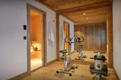 a gym with two exercise bikes in a room at Chalet Lauda - OVO Network in Saint-Nicolas-de-Véroce