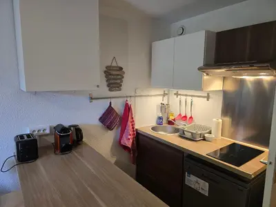 a kitchen with a sink and a counter top at Studio à 2 mn à pied des pistes de Mégève in Demi-Quartier