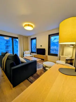 a living room with a couch and a table at Les Sources de Canopée A0105 By Avecoeur in Saint-Gervais-les-Bains