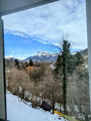 a view of a snow covered mountain from a window at Les Sources de Canopée A0105 By Avecoeur in Saint-Gervais-les-Bains