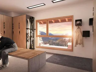 a person sitting on a bench in a room with a window at Appartement Familial 3 Pièces Pied de Piste avec Parking - FR-1-572-350 in Arâches-la-Frasse