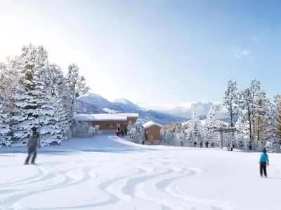 a group of people skiing down a snow covered slope at Appartement Familial 3 Pièces Pied de Piste avec Parking - FR-1-572-350 in Arâches-la-Frasse
