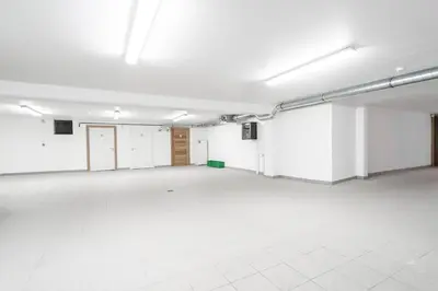 an empty room with white walls and a white floor at Appartement JASIONE-MEGEVE in Megève