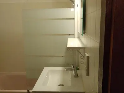 a bathroom with a sink and a bath tub at Studio 4 pers Centre Station - Animaux OK - FR-1-836-65 in Arâches-la-Frasse