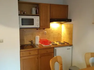 a small kitchen with a sink and a microwave at Studio 4 pers Centre Station - Animaux OK - FR-1-836-65 in Arâches-la-Frasse