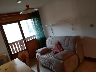 a living room with a couch and a table at Charmant Appartement au Centre, Animaux Admis, 4 pers. - FR-1-836-64 in Arâches-la-Frasse