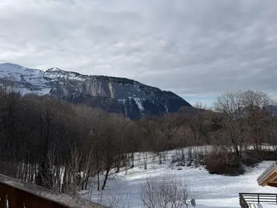a snow covered mountain in the distance with a snow covered slope at Chalet lumineux pour 11 pers à 2 pas de Flaine avec parking - FR-1-572-351 in Arâches-la-Frasse