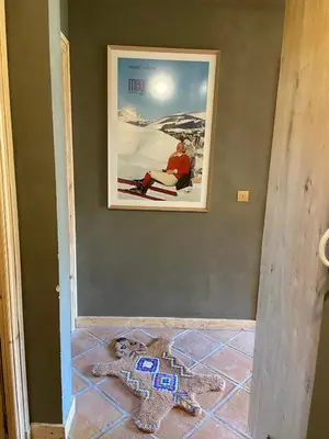 two stuffed animals on the floor in a room with a picture at Soul Megève Panoramic View, Fireplace, Parking in Megève