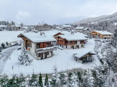 an aerial view of a house covered in snow at Chalet Le 34 Megève - Chalet dexception in Le Planellet