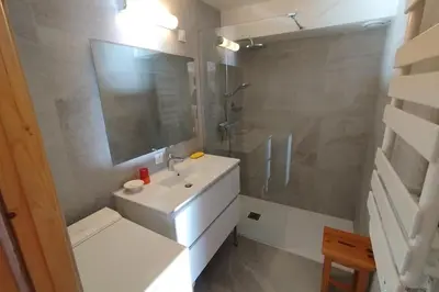 a bathroom with a white sink and a shower at Apt or chalet near the village Combloux in Combloux
