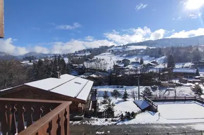 a view of a snow covered mountain with a house at Apt or chalet near the village Combloux in Combloux