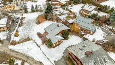 an aerial view of a house covered in snow at White Chalet in Combloux