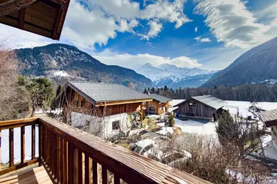 a view from the deck of a cabin in the mountains at Apartment near the slopes in Servoz in Servoz