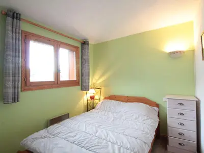 a small bedroom with a bed and a window at 2 Pièces Cabine près des Pistes avec Parking Inclus - FR-1-572-352 in Arâches-la-Frasse