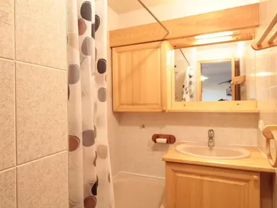 a bathroom with a sink and a mirror at 2 Pièces Cabine près des Pistes avec Parking Inclus - FR-1-572-352 in Arâches-la-Frasse