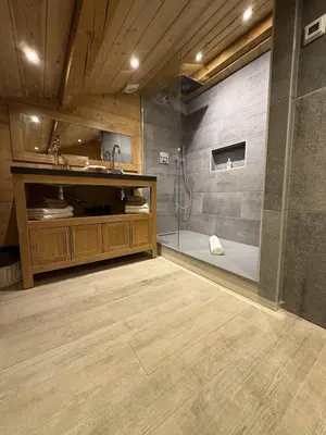 a bathroom with a shower and a sink at Chalet du Gouter in Les Houches