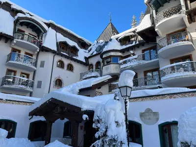 a street light covered in snow next to a building at Bel appartement avec vue exceptionnelle in Chamonix-Mont-Blanc
