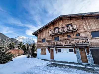 a snow covered field with mountains in the background at Apartment Vent d'Est by Interhome in Mémontel
