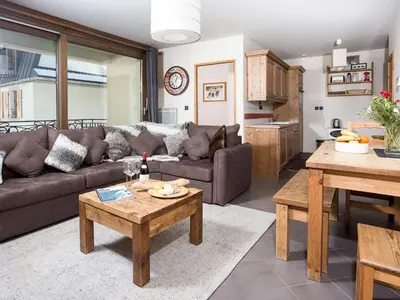 a living room with a couch and a table at Apartment Le Paradis Ski Wohnung by Interhome in Chamonix-Mont-Blanc