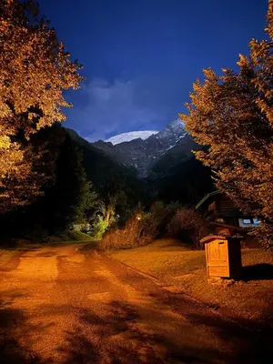 a dirt road with a mountain in the background at Chalet Du Goûter Room Bionnassay, Les Houches in Les Houches