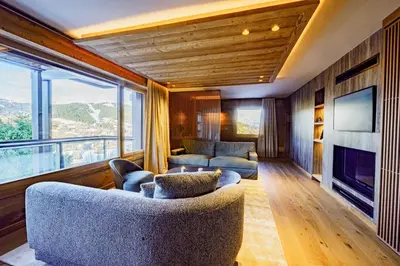 a living room with two couches and a large window at Modern Alpine Chalet a c 4BR 7P - Megève in Megève