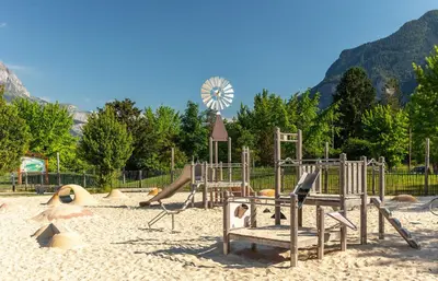 a playground with a slide at Camping Les Iles in Passy