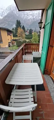 a white picnic table and chairs on a balcony at L'Alp'Inn - 4 pax, Chamonix Valley - Cozy Flat, Ski & Supermarket in Les Houches