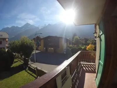 a view of the mountains from the balcony of a house at L'Alp'Inn - 4 pax, Chamonix Valley - Cozy Flat, Ski & Supermarket in Les Houches