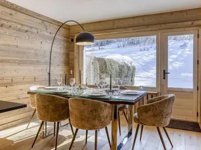 a dining room with a table and chairs and a window at Appartement 3 Chambres, Terrasse Sud/Ouest, Parking - Megève - FR-1-453-331 in Megève