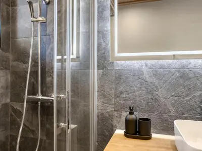 a bathroom with a shower and a sink at Appartement 3 Chambres, Terrasse Sud/Ouest, Parking - Megève - FR-1-453-331 in Megève