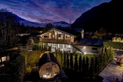 a house with a boat in front of it at Papillon Chamonix Chalet in Chamonix-Mont-Blanc