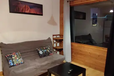a living room with a couch and a table at T2 pour 6 pers Les Houches in Les Houches