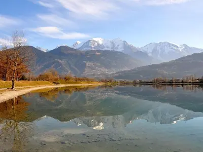 a large body of water with mountains in the background at T2 pour 6 pers Les Houches in Les Houches
