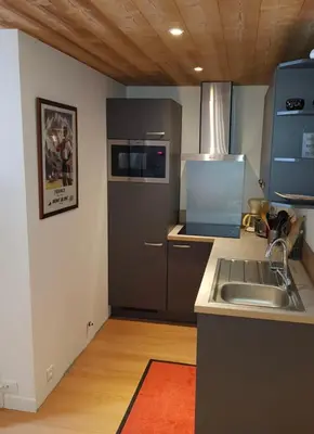 a kitchen with a sink and a stove at Apartment near Aiguille du Midi with balcony in Chamonix-Mont-Blanc