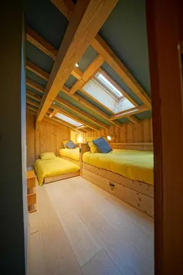 a bedroom with two beds in a room with a window at Warm Alpine apartment 2BR 5P - Megeve in Megève
