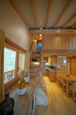 a large room with a kitchen and a dining table at Warm Alpine apartment 2BR 5P - Megeve in Megève