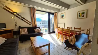 a living room with a table and a dining room at Résidence Aldebaran - Appartement lumineux · Au pied des pistes · Balcon MAE-5014 in Magland
