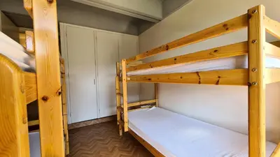 a couple of bunk beds in a room at Résidence Aldebaran - Appartement lumineux · Au pied des pistes · Balcon MAE-5014 in Magland