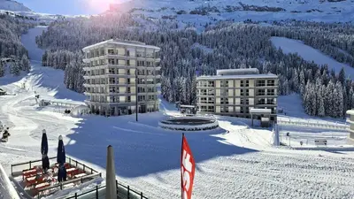 a resort in the snow with buildings in the background at Résidence Aldebaran - Appartement lumineux · Au pied des pistes · Balcon MAE-5014 in Magland