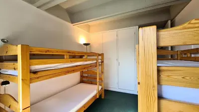 a couple of bunk beds in a room at Résidence Aldebaran - Appartement spacieux · Départ et retour ski aux pieds · Balcon MAE-5024 in Magland