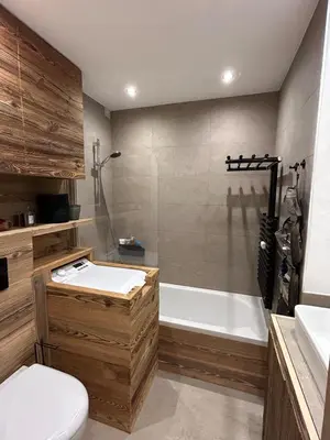 a bathroom with a tub and a toilet and a sink at Megeve-Fully renovated Appartment- 10mn from village in Megève