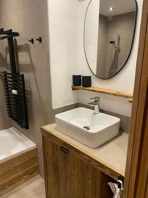 a bathroom with a sink and a mirror at Megeve-Fully renovated Appartment- 10mn from village in Megève