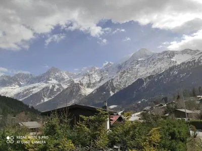 a view of a mountain range with snow covered mountains at Savoyard chalet 6pers exceptional view in Les Houches