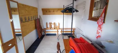 a room with red chairs and a room with a room with a room at Savoyard chalet 6pers exceptional view in Les Houches