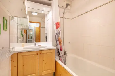 a bathroom with a sink and a tub and a shower at Gélinotte 23 - Station de ski à pied in Morillon